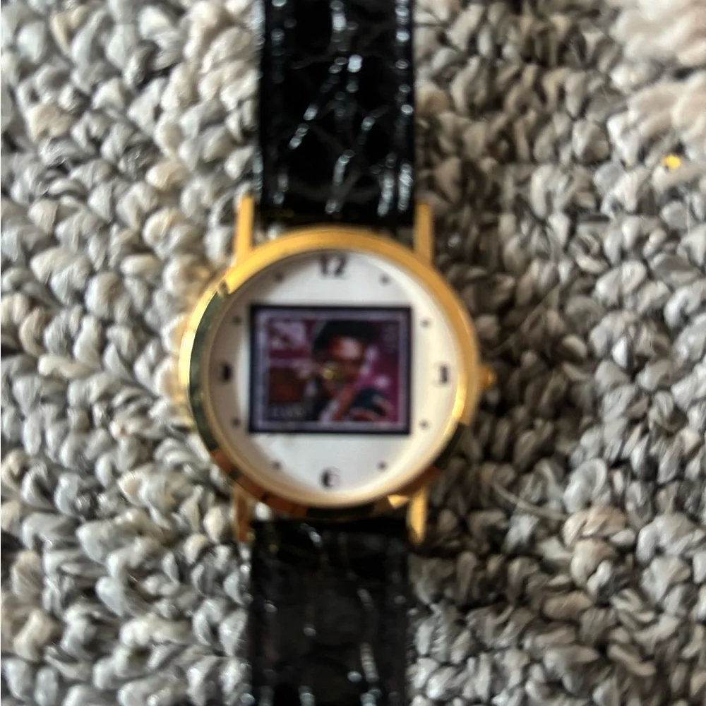 Gold and Black Wearable Watch face if Elvis Presley